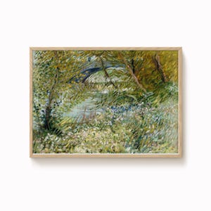 May include: A framed landscape painting in a wooden frame. The artwork shows a tranquil river scene with a bridge, surrounded by verdant foliage and trees. The painting uses a palette of greens, yellows, and blues, evoking a sense of calm.