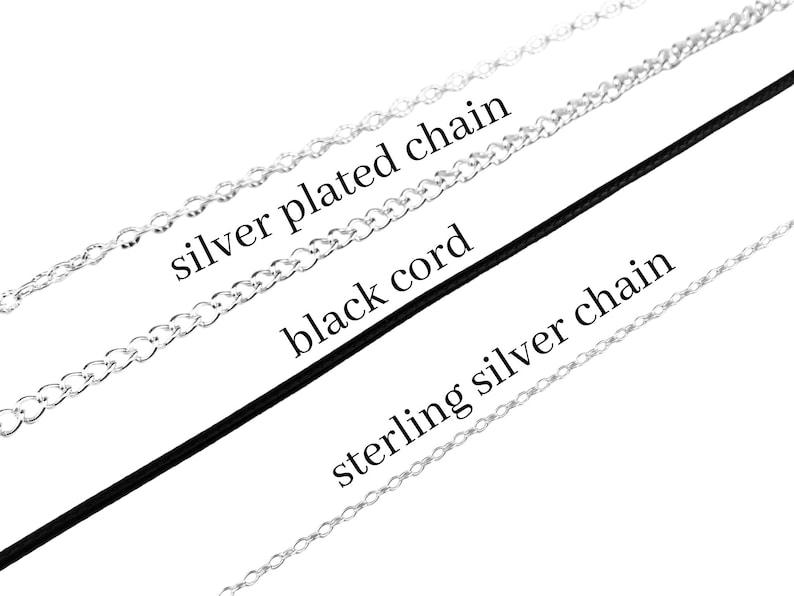 May include: Three necklace options displayed diagonally: a silver plated chain, a smooth black cord, and a sterling silver chain. Each item is labelled with its corresponding name in black text, clearly identifying the material and style of each.