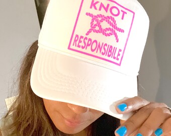 Knot responsible white foam trucker hat with neon pink writing color of hat and writing can be customized great for boat lake days
