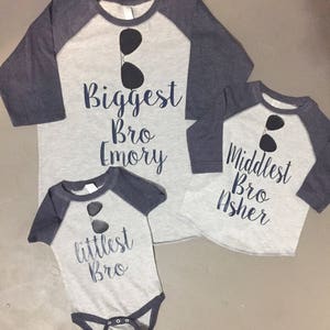 Biggest middlest and littles bro matching raglan shirts with aviators names are included great for pregnancy announcements