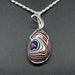 see more listings in the Fordite Pendants section