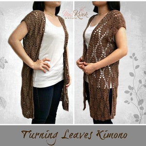 May include: A brown crochet kimono with a leaf pattern. The kimono has a V-neck and short sleeves. The model is wearing the kimono over a white t-shirt and jeans. "Turning Leaves Kimono" is written in brown text at the bottom of the image.
