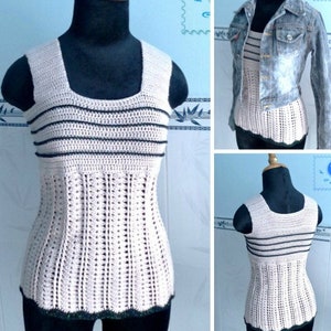 May include: A crocheted tank top with wide straps and a striped pattern in beige and black. The top has a scalloped hem and is displayed on a mannequin.