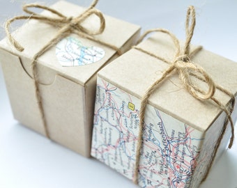 Travel themed party favor, map atlas paper on brown kraft favour boxes