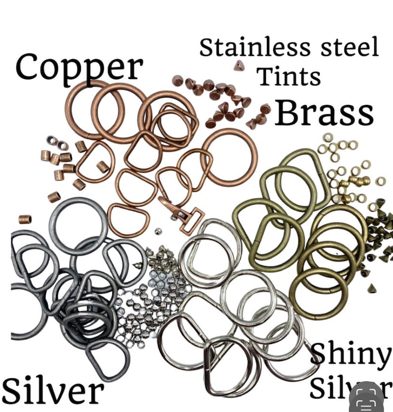 Op de afbeelding: Assortiment van metalen ringen en springringen in koper, messing, roestvrij staal en zilveren afwerkingen. De ringen zijn in verschillende maten en vormen, waaronder rond, ovaal en D-vormig. De ringen zijn ideaal voor het maken van sieraden, knutselen en andere doe-het-zelfprojecten.