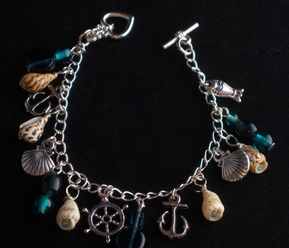 Items similar to sea shell and sea charm bracelet on Etsy