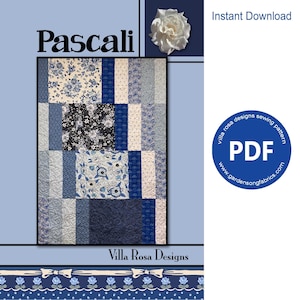May include: A digital download PDF sewing pattern for a quilt called "Pascali" by Villa Rosa Designs. The quilt features a patchwork design with blue, white and black fabrics. The pattern is available for instant download.