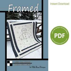 May include: A white quilt with a black and white snowman design. The quilt is framed with a black and white border. The quilt is on a snowy background. The text "Framed" is at the top of the image. The text "Tricia Lynn Maloney Orphan Quilt Designs for Villa Rosa Designs" is at the bottom of the image. The text "Instant Download" is in the top right corner of the image. The text "villa rosa designs sewing pattern PDF www.gardensongfabrics.com" is in a green circle in the top right corner of the image.
