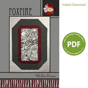 May include: A digital download PDF sewing pattern for a quilt titled "Foxfire" by Villa Rosa Designs. The quilt features a central panel with a zebra, tiger, leopard, and elephant print. The pattern is available for instant download.