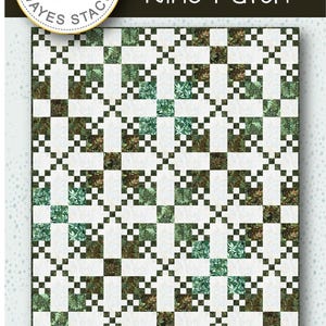 May include: A quilt pattern titled "Irish Nine Patch" with a repeating pattern of white, green, and brown squares. The quilt measures 67.5 x 81 inches. The design includes the text "Needle in a Hayes Stack" and the brand name "Hoffman".