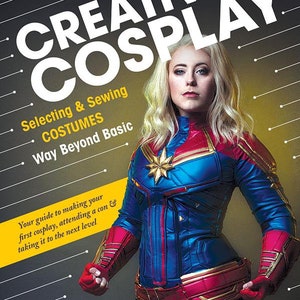 May include: A book cover with the title "Creative Cosplay: Selecting & Sewing Costumes, Way Beyond Basic". The cover features a woman dressed as Captain Marvel, with a yellow background and black lines.