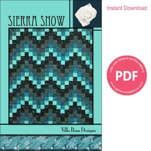 May include: A digital download PDF sewing pattern for a quilt called "Sierra Snow". The quilt features a blue and black checkered pattern with a snowflake border. The pattern is available for instant download from Villa Rosa Designs.