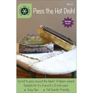 May include: A sewing pattern titled Pass the Hot Dish! by Around the Bobbin, featuring two fabric baskets for 9 x 9 and 9 x 13 inch pans. One basket is yellow with a chicken print, and the other is grey with a vegetable print. Text includes STORES FLAT!