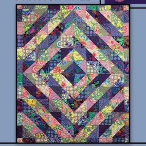 May include: A quilt pattern called "Drayton Hall" by Villa Rosa Designs. The quilt is made up of colorful fabric squares in shades of purple, pink, blue, green, and yellow. The squares are arranged in a geometric pattern.