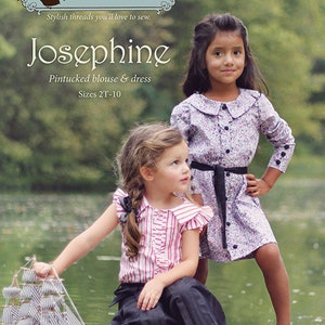 May include: Two girls wearing dresses, one in a pink and white striped blouse and a black skirt, the other in a floral print dress with a black belt. The girls are standing in front of a body of water with a toy sailboat in the foreground. The image includes the text "Violette Field Threads patterns and tutorials Stylish threads you'll love to sew. Josephine Pintucked blouse & dress Sizes 2T-10"