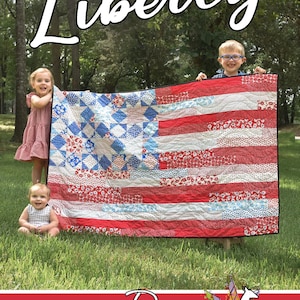 May include: Three children hold a large red, white, and blue quilt with a star pattern. The quilt is made of fabric scraps and has a black border. The quilt is held in front of a green grassy area with trees in the background. The text "Liberty" is written in white cursive at the top of the image. The text "Running Doe Quilts for Villa Rosa Designs" is written in white cursive at the bottom of the image.