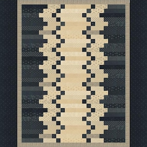 May include: A rectangular quilt with a central beige panel flanked by two zigzagging columns of black squares. The quilt features horizontal stripes in shades of beige, gray, and navy blue, with a navy blue border. The overall design is geometric and modern.