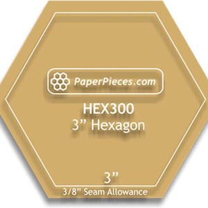 May include: A tan hexagon shape with a white border. The text "PaperPieces.com" is in a white rectangle. Below it is "HEX300 3" Hexagon". At the bottom is "3"" and "3/8" Seam Allowance".