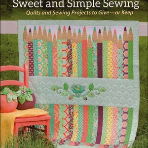 May include: A colorful quilt with a pencil design, titled "Sweet and Simple Sewing." The quilt features various patterned fabrics in shades of green, red, and yellow. A small pink chair with decorative items sits in front of the quilt. The book cover features the names Jessi Jung, Carrie Jung, and Lauren Jung.