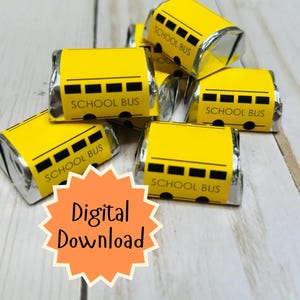 May include: Yellow candy wrappers with a school bus design and the words "SCHOOL BUS" printed on them. The wrappers are silver on the sides and are arranged on a light wood surface. The words "Digital Download" are in an orange starburst.