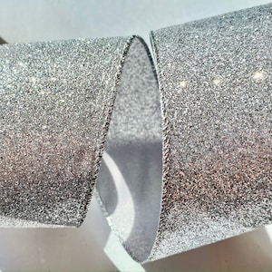 5 yards of 2 1/2 inch Silver Glitter Ribbon with a Wired Edge, Length is continuous up to 50 yards