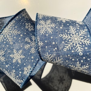 5 yards of 2 1/2 inch Snowflakes with a touch of accent Glitter Ribbon and a Wired Edge, Length is continuous up to 50 yards