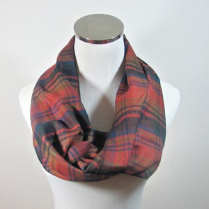 May include: A red, green, and blue plaid infinity scarf. The scarf is made of a soft, warm fabric and is perfect for keeping you warm in the winter.