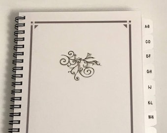 Personlig adressbok med A-Ö-flikar och lösenordssidor, spiralbunden organizer