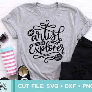 May include: A gray t-shirt with black text that reads "An artist is an explorer" with the words "Henri Matisse" in a circle below.