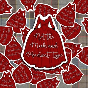 May include: Red dress sticker with the text "Not the Meek and Obedient Type" in white cursive font. The sticker is shaped like a dress with a full skirt and long sleeves.