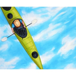 May include: A person in a blue shirt and a straw hat paddles a green kayak on a bright blue sky with white clouds.