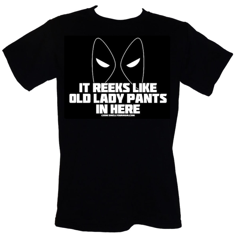 May include: Black t-shirt with a white graphic of a masked face and the text "It reeks like old lady pants in here".