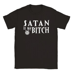 May include: Black t-shirt with white text that reads "Satan is my Bitch" with a small devil face graphic.