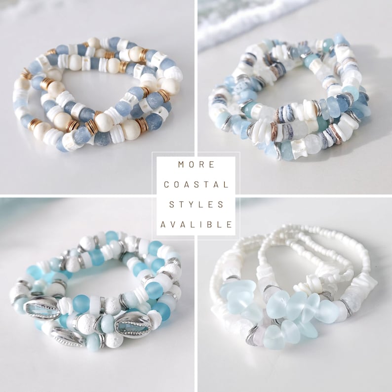 May include: Four stacks of coastal-themed bracelets. Each bracelet features a mix of white, blue, and gold beads, shells, and other decorative elements. The text "MORE COASTAL STYLES AVALIBLE" is visible in the center.