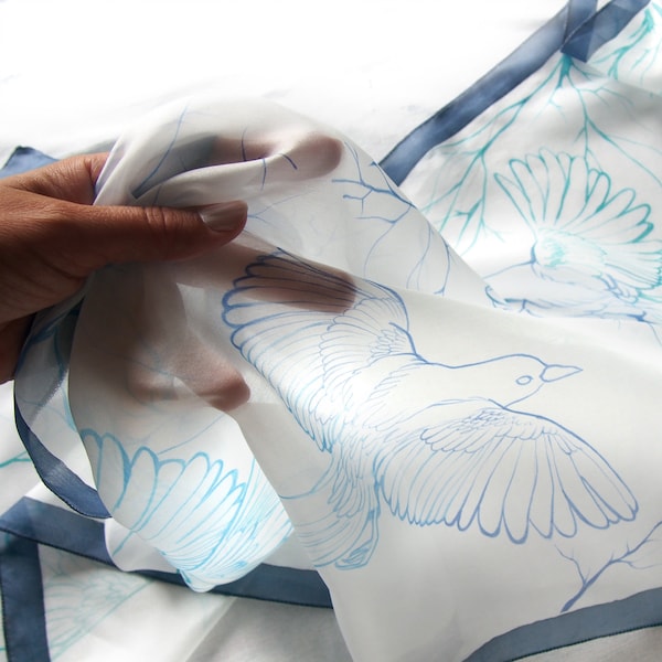 White long scarf with magpies birds flying hand painted on lightweight silk in turquoise and blue