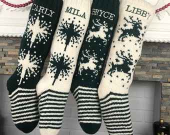 May include: Four personalized Christmas stockings with green and white stripes. The stockings are decorated with snowflakes and reindeer. The names "Carly", "Mila", "Bryce", and "Libby" are embroidered on the stockings.