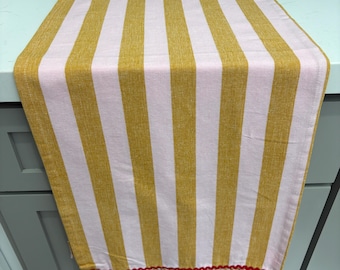 Woven cotton striped pink and sand colored table runner with ruffle & ric rac trim