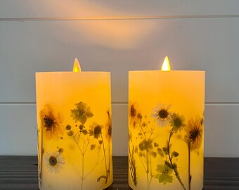 LED wax  candle with press botanical flowers six hour timer requires three AAA batteries