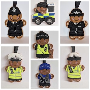 May include: Set of seven felt gingerbread ornaments, each depicting a police officer in a different uniform. The ornaments are brown, black, blue, white, and yellow.  The ornaments are decorated with details like badges, hats, and guns.