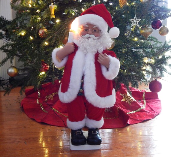 Santa Claus i an old warehouse looking at holographic christmas tree