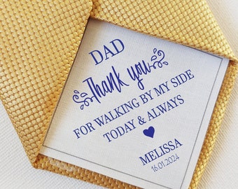 May include: A gold tie with a white card attached to it. The card says "DAD Thank you for walking by my side today & always" with a heart and the name "MELISSA" and the date "16.01.2024".
