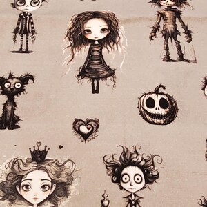 May include: A gray fabric featuring a repeating pattern of whimsical, gothic-style illustrations. The drawings include characters with large eyes, pumpkins, and heart shapes. The artwork is in black and white, creating a spooky, yet charming aesthetic.