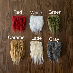 May include: Six swatches of faux fur in different colors: red, white, green, caramel, latte, and gray. The swatches are arranged in two rows of three, with the colors labeled above each swatch.