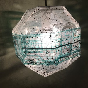 circuitry pendant lamp, made of upcycled and recycled computer keyboards, cast shadows, hanging light, science fiction lamp, nerd lamp,