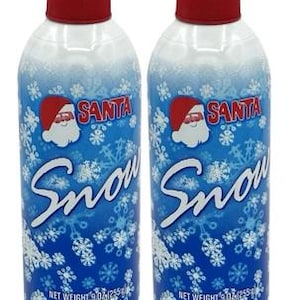 May include: Two cans of Santa Snow spray with red caps. The cans have a blue background with white snowflakes and the word "Snow" in a cursive font. The cans also feature a Santa Claus graphic.