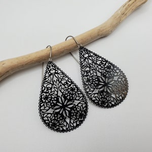 May include: A set of three ceramic mugs with a speckled, matte finish. The mugs are in shades of cream, light gray, and dark gray. Each mug has a simple, minimalist design, perfect for coffee or tea.