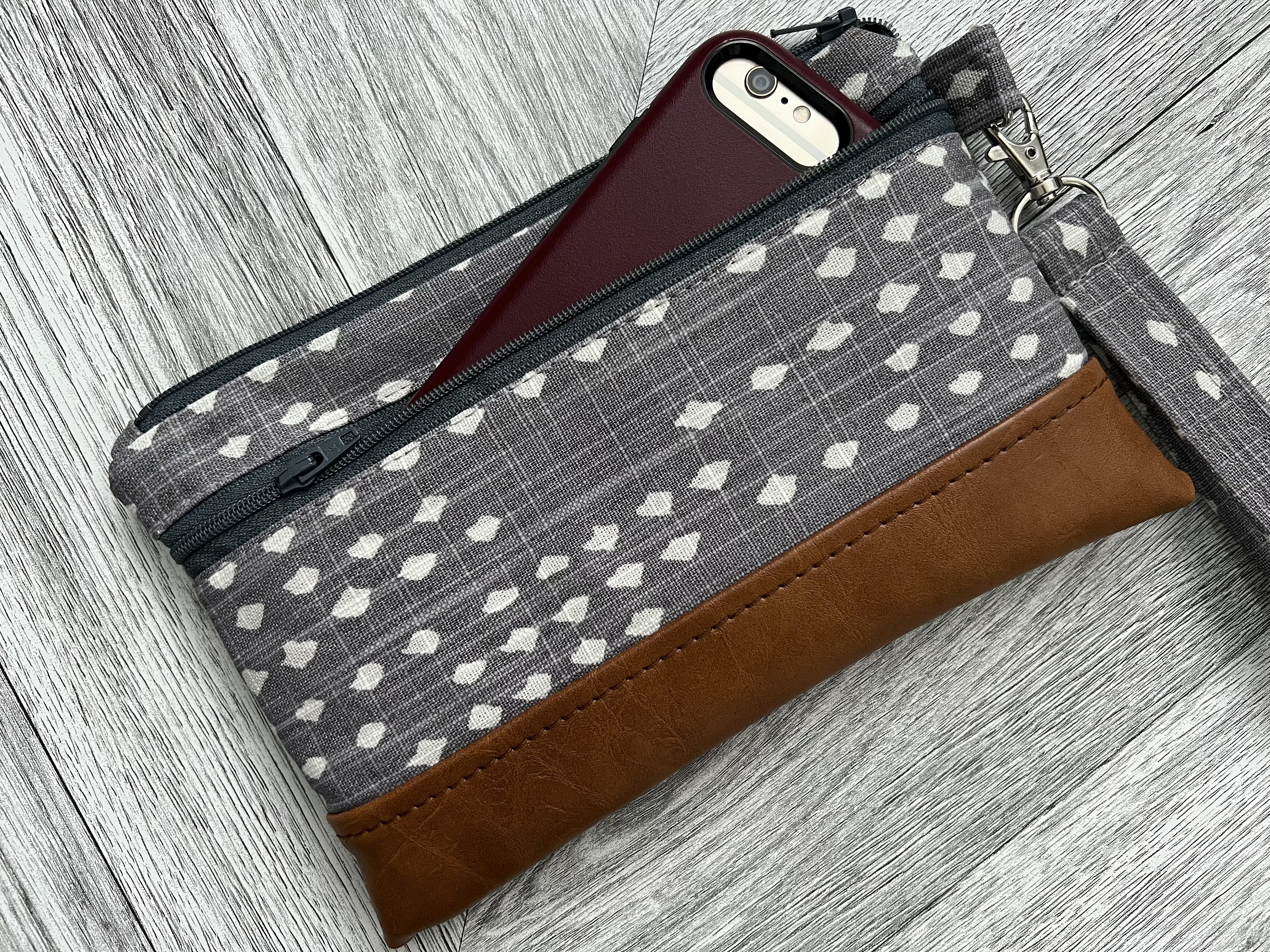 gray leather wristlet