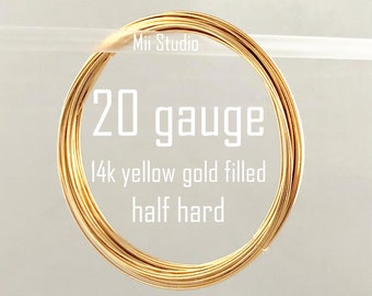 May include: A close-up of a coil of 20 gauge, 14k yellow gold filled, half hard wire.  Mii Studio is printed on the wire.