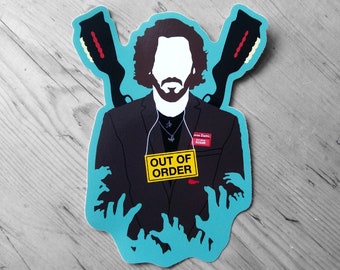 Può includere: Un adesivo blu e nero con la silhouette di un uomo in abito che indossa un cartellino con la scritta "Fuori servizio". L'uomo tiene due pistole ed è circondato da mani di zombie blu.