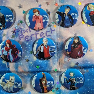 May include: Nine round blue and white buttons featuring different characters from the video game Persona 3. Each button displays the text "P3" and "PERSONA 3" in white. The buttons showcase various characters from the game, including a dog, a girl with red hair, a boy with blue hair, and a girl with blonde hair.